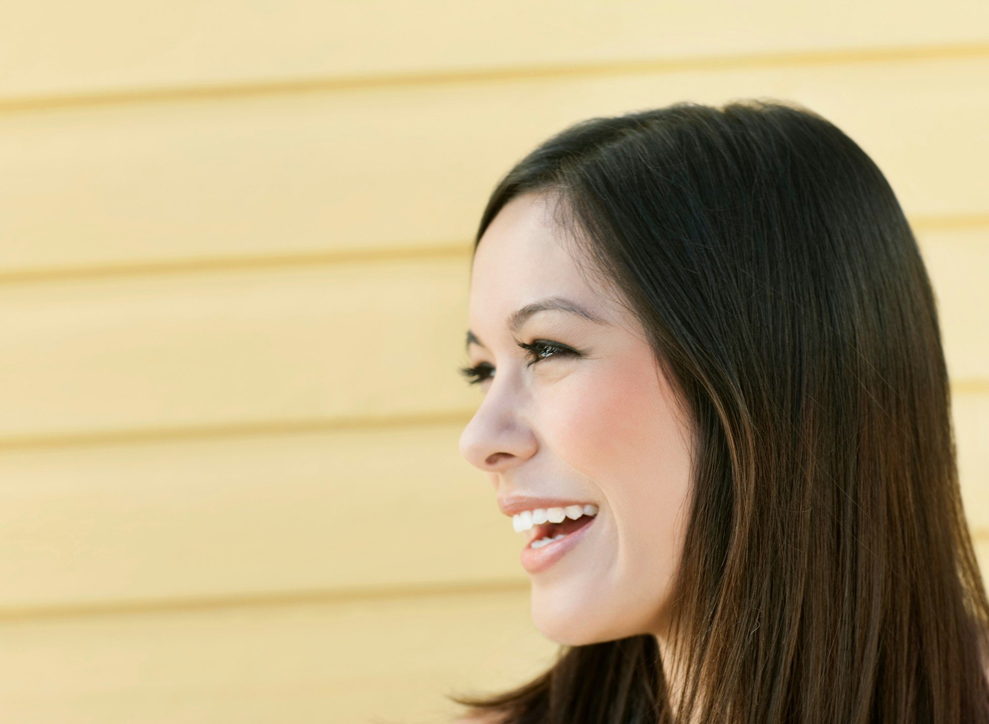 Side portrait of woman smiling
