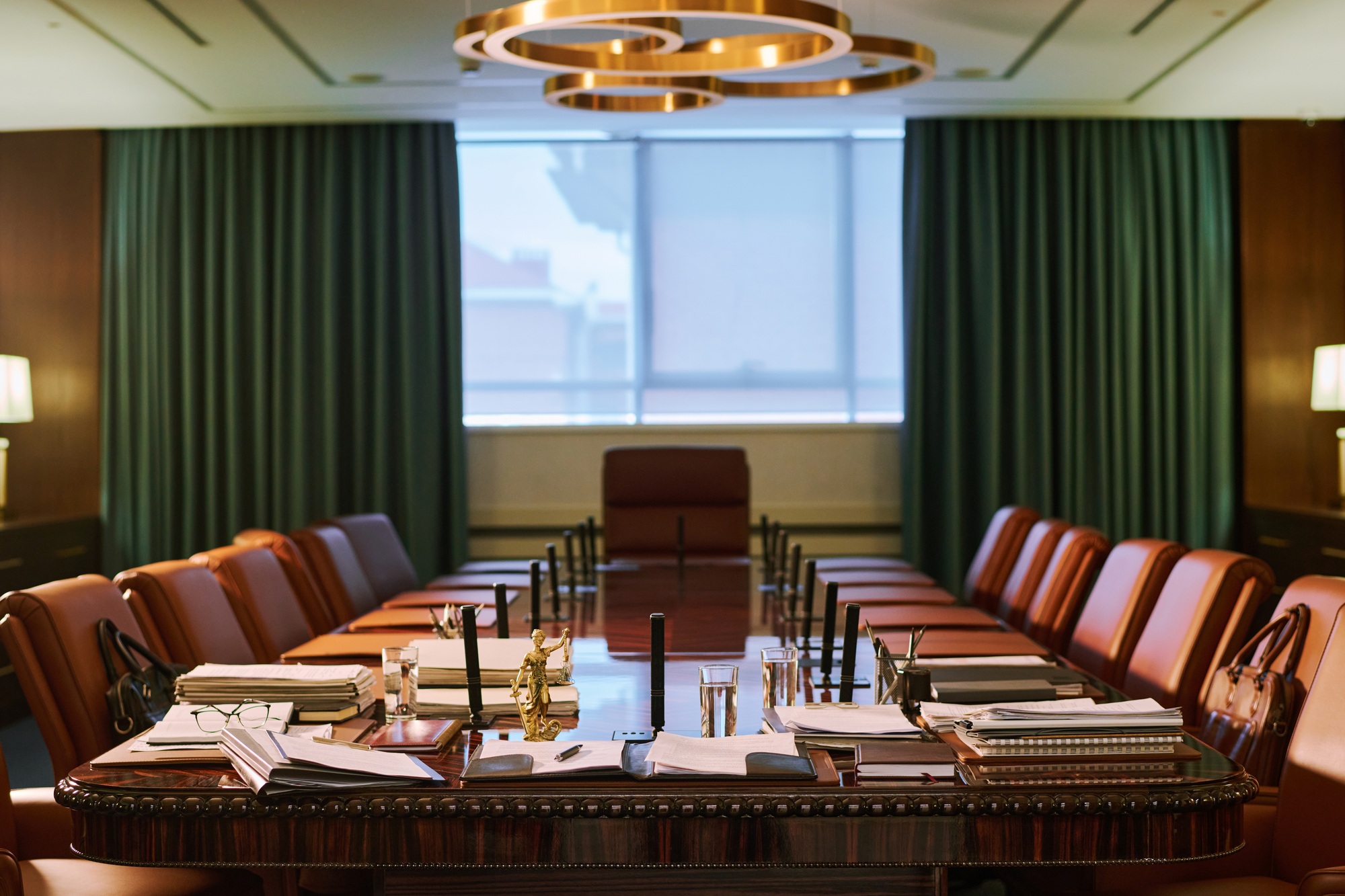 Armchairs surrounding long table