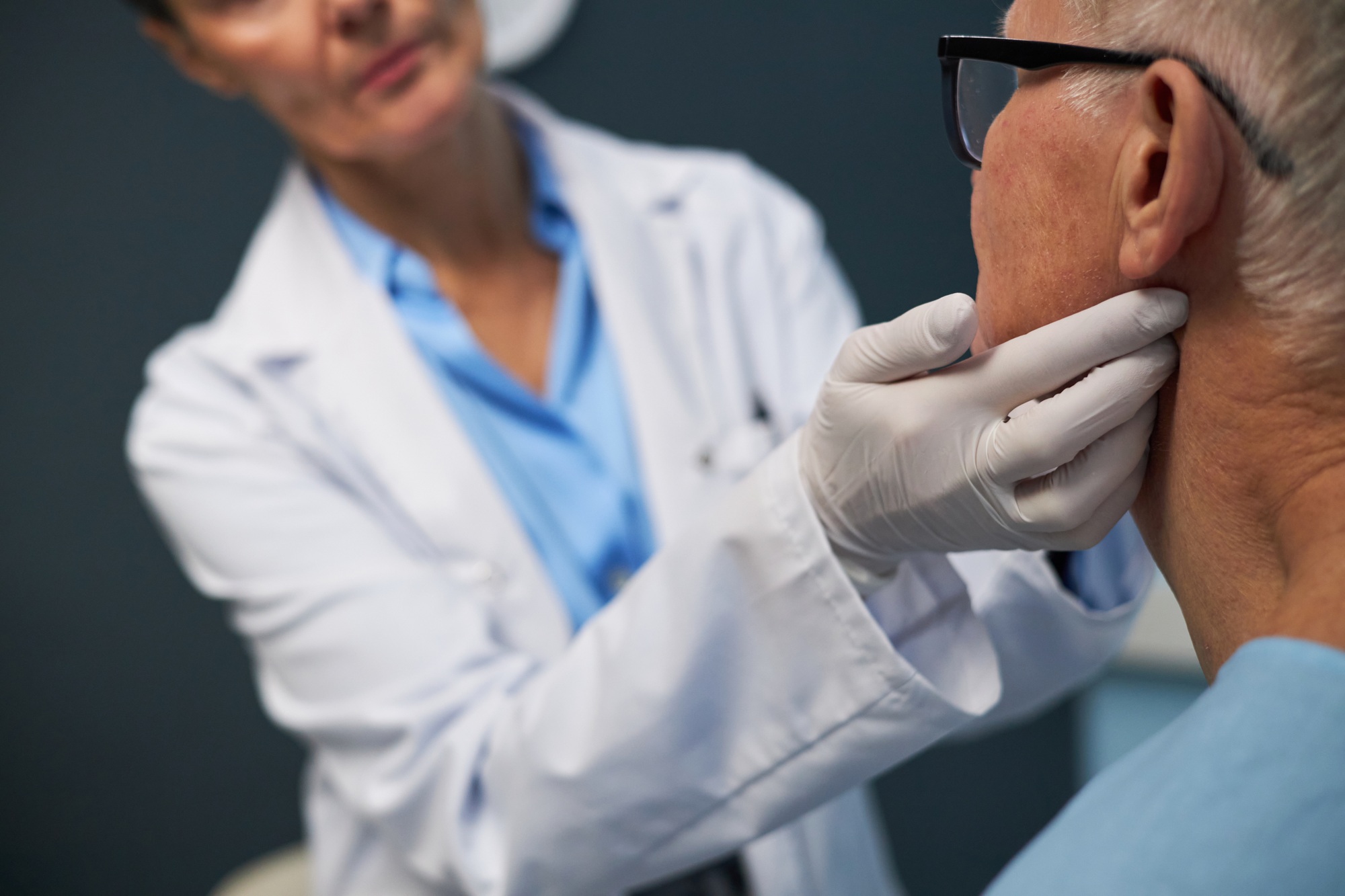 Medical Professional Examining Elderly Patient's Health